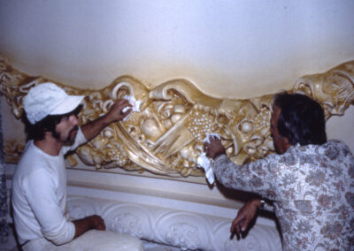 Restoration workers applying Dutch me