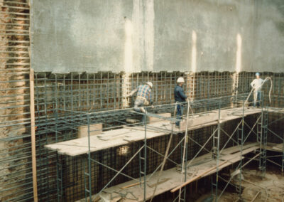 Shotcrete being applied to interior walls