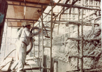 Spraying shotcrete on interior walls