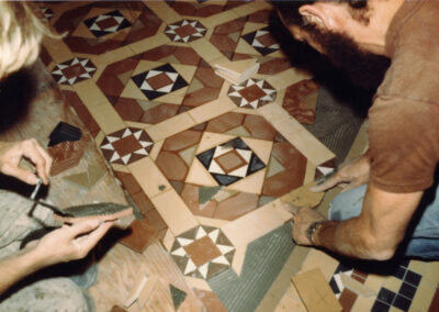 Workers laying Minton reproduction tiles in the rotunda