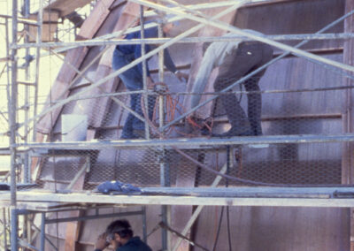 Working on metal exterior of dome